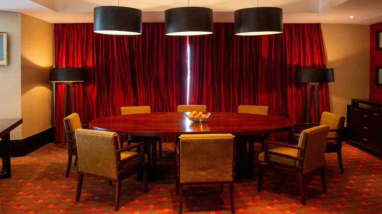 Thick red curtains in a dining room