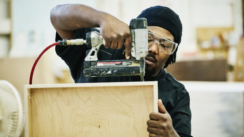 Man building a drawer box