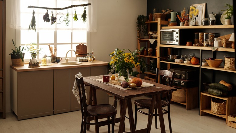 This kitchen uses light curtains to add to the cottagecore look.