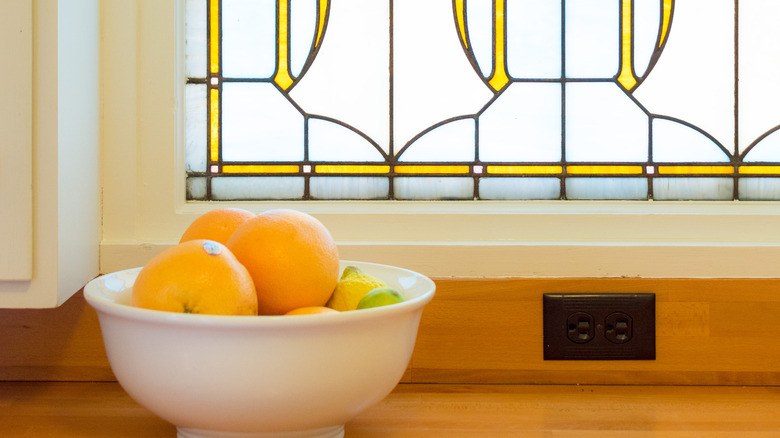 oranges in front of stained glass