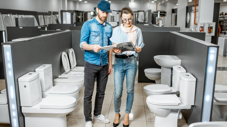 couple choosing toilet bowl