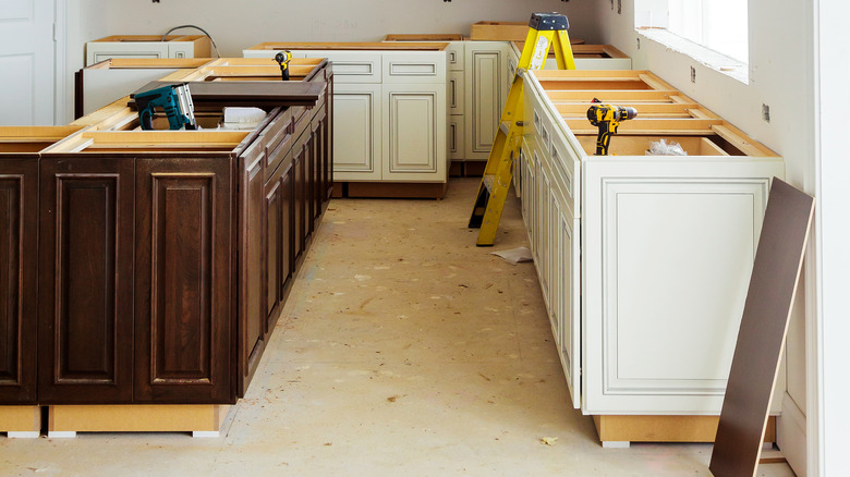 cabinets being install in kitchen