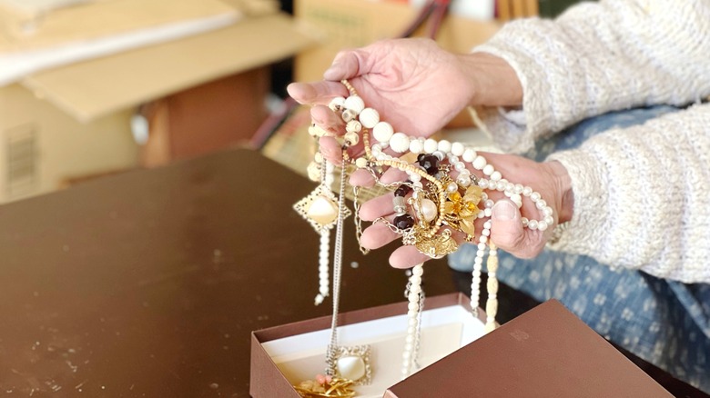 Sorting through antique jewelry