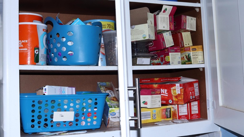 cluttered kitchen cabinets