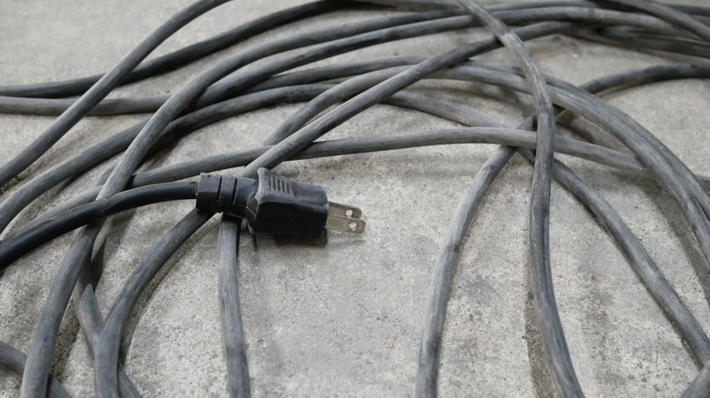 Black extension cord on floor.