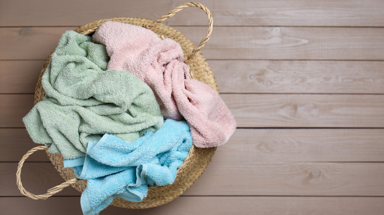 A pile of untidy kitchen rags in a basket