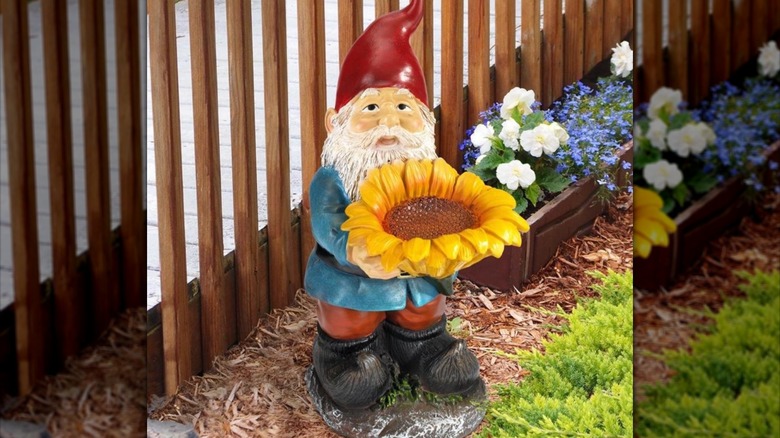 gnome with sunflower statue