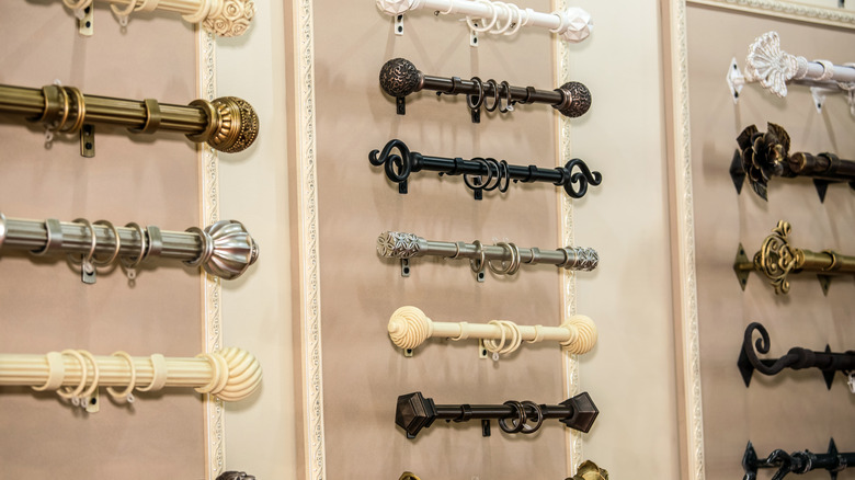 Curtain rods on wall in store with decorative finials