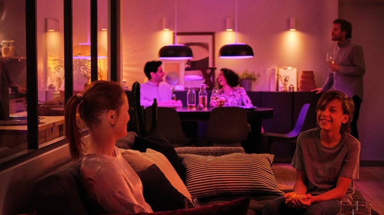 family in pink lit room