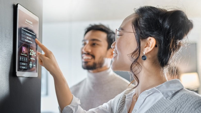 couple using smart home device