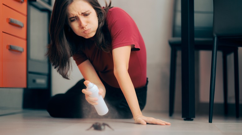 Woman killing spider