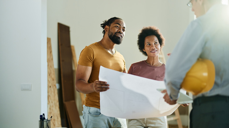 Couple looking at house plans