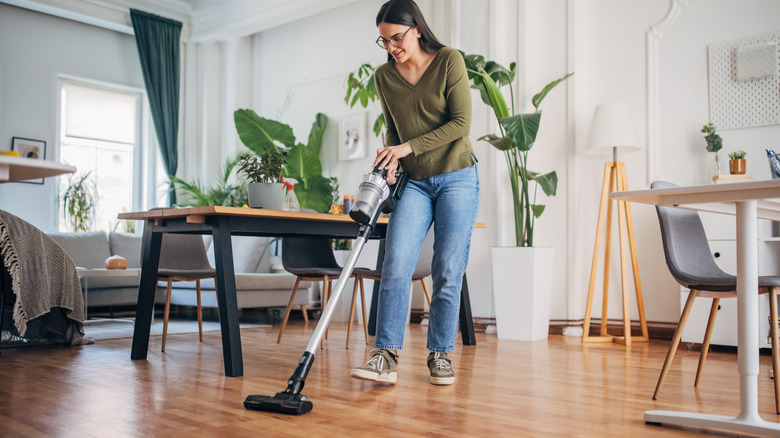 Vacuuming living room floor