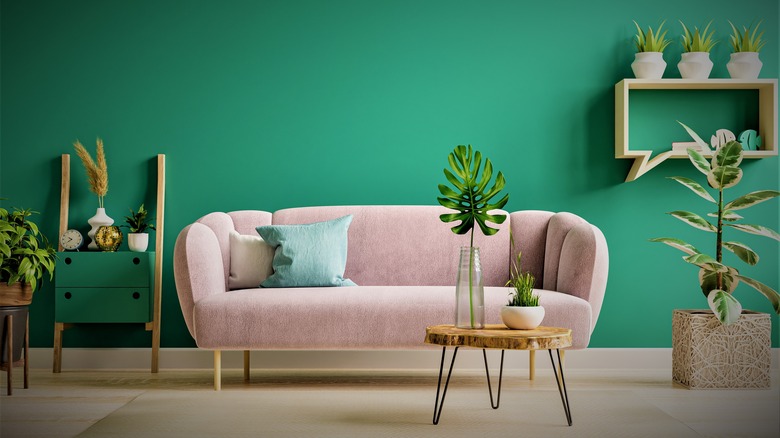 Neutral sofa and green wall