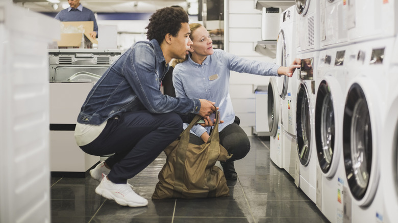 couple shopping for washing machine