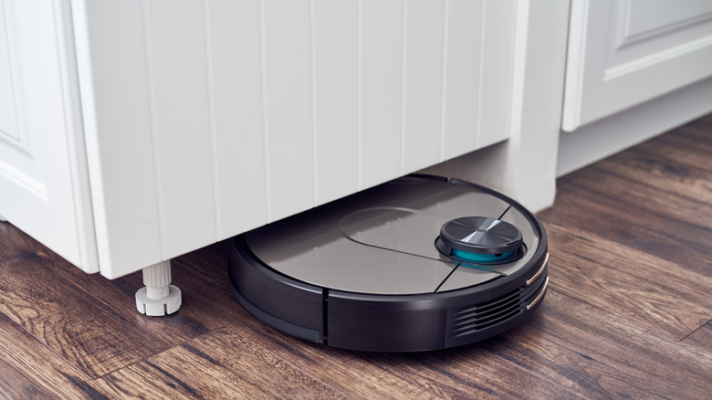 Robot vacuum cleaning under cabinet