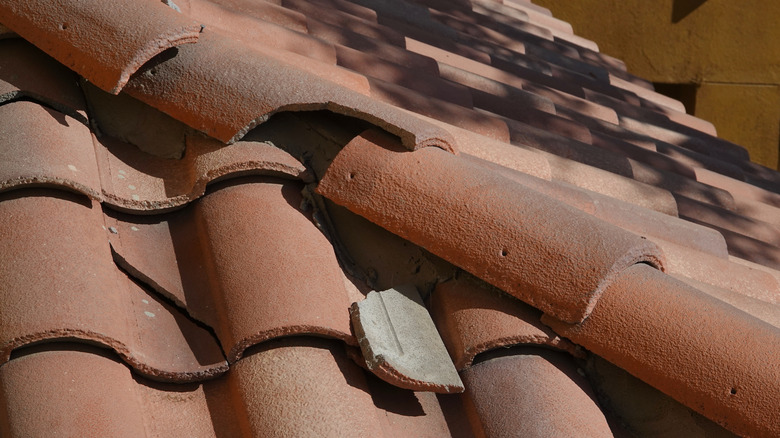 Cracked tile on clay tile roof