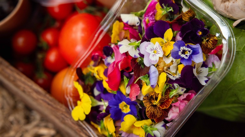 Edible flowers in clear container