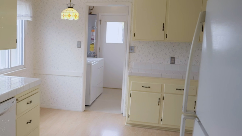 white and yellow outdated kitchen