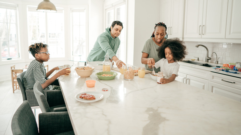 Family eating at kitchen island 