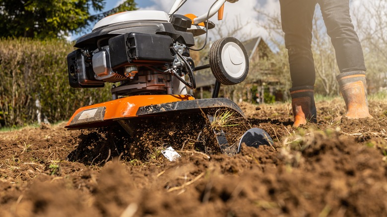 gardener using a tiller