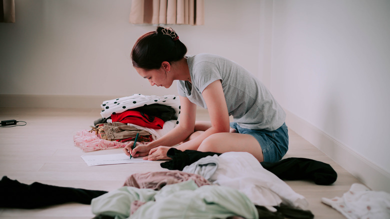 Person sorting through closet