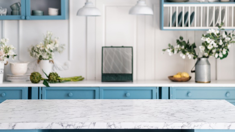 Blue cabinets with white counters