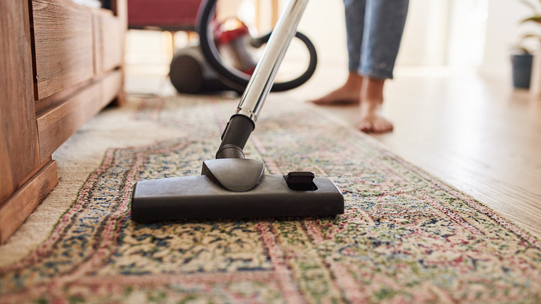 rug being vacuumed