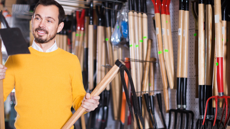 Man shopping for lawn tools