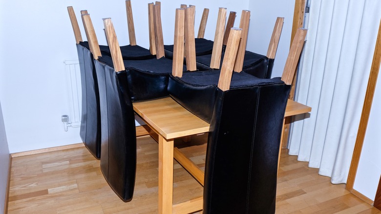 Upside down chairs on dining table