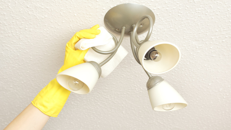 Cleaning ceiling light fixture