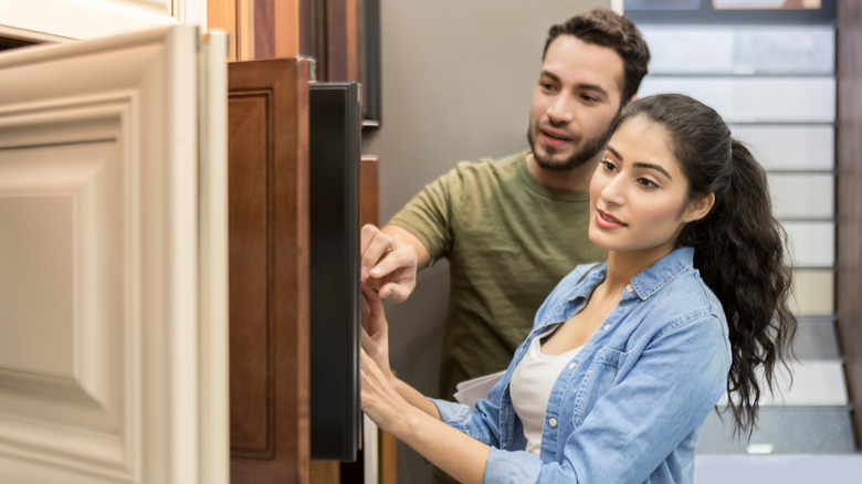 couple shopping for cabinets