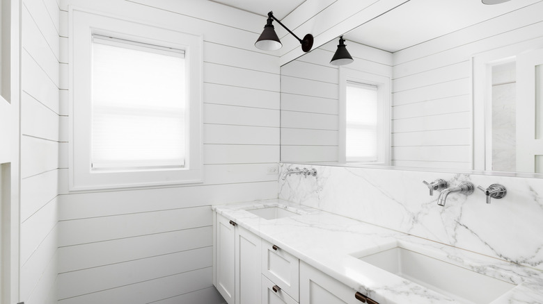 farmhouse bathroom with shiplap wall