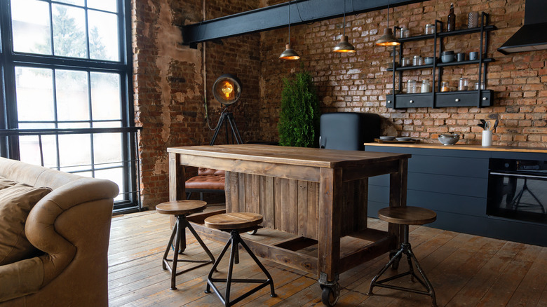 industrial kitchen with brick wall backsplash