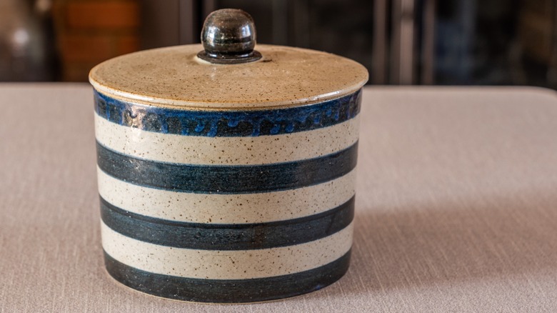 Crock with painted blue stripes