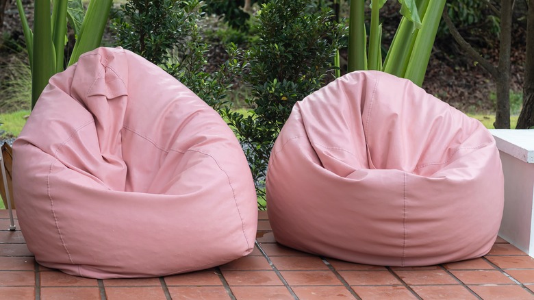 Two pink outdoor bean bags