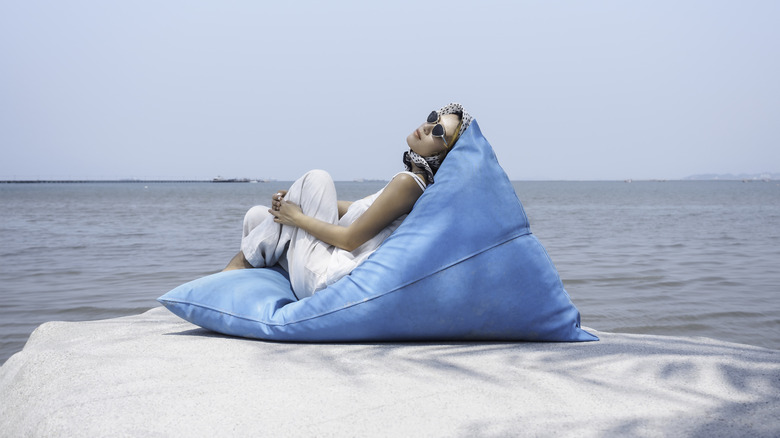 Woman relaxing on bean bag