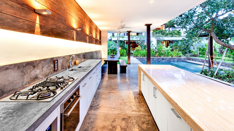 Butcher block wooden countertops in a modern outdoor kitchen.