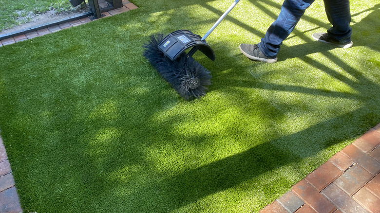 Person installing turf