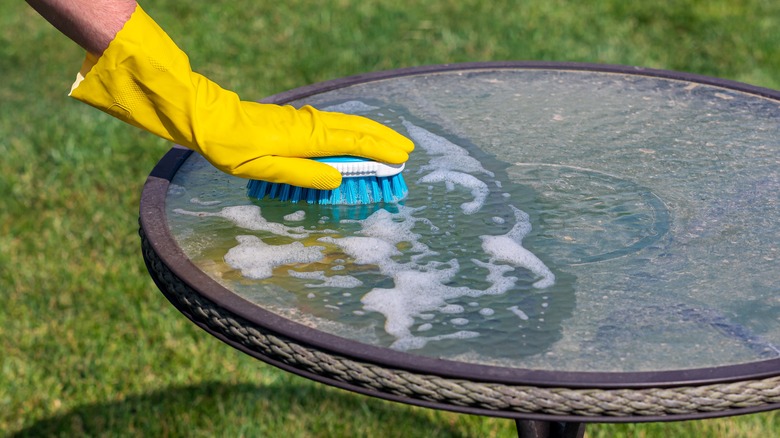 Hand cleaning outdoor furniture