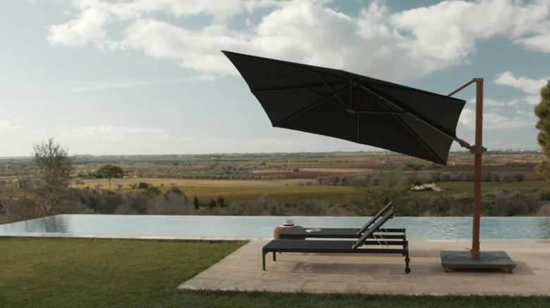 pool area umbrella lounge chairs