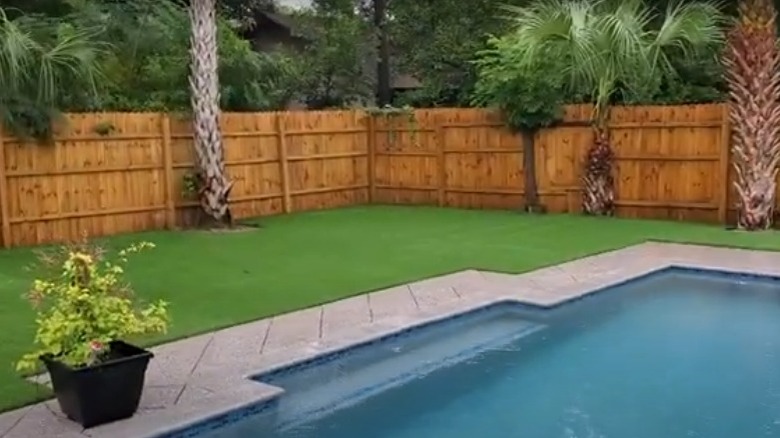 privacy fence artificial grass pool area