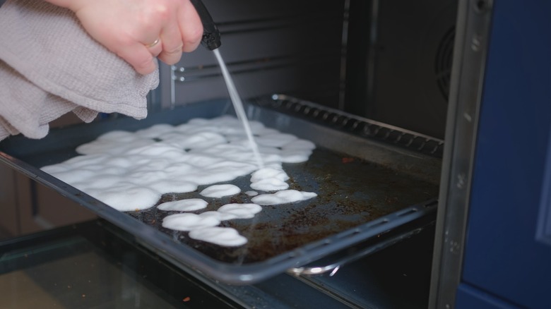 Applying foaming oven cleaner