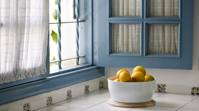 blue window with lemon bowl