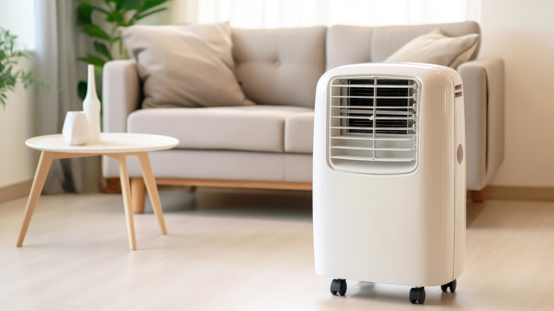 portable air conditioner or mobile air cooler in modern living room