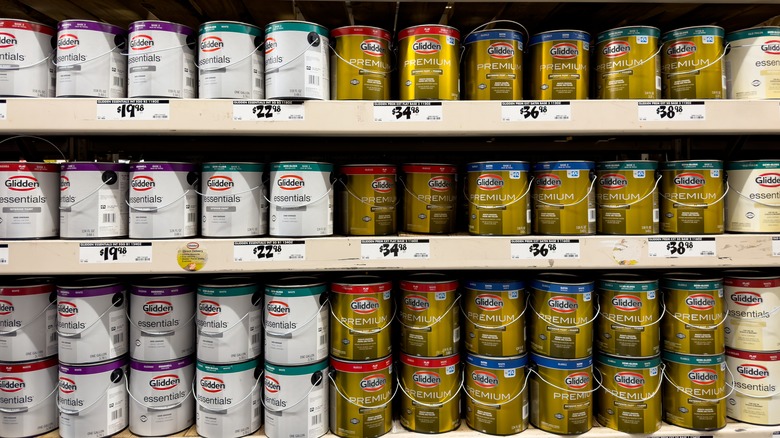 shelf full of paint cans