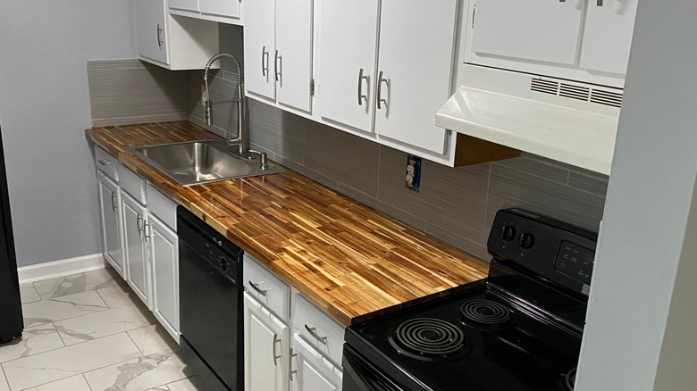 White kitchen with mismatched countertop