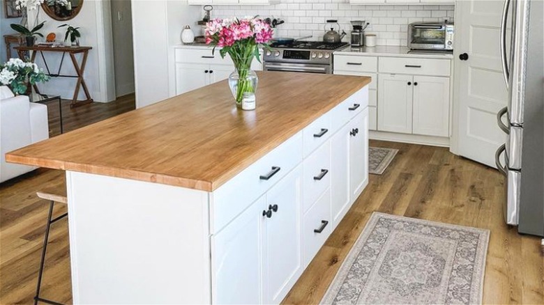 White kitchen with wood countertop