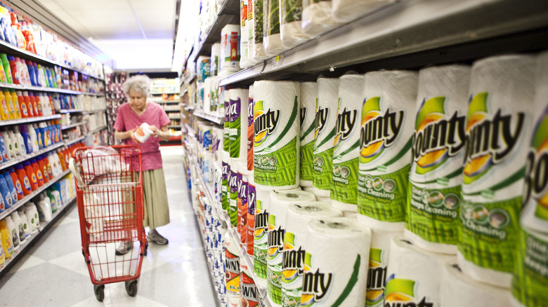 A woman shopping for paper goods