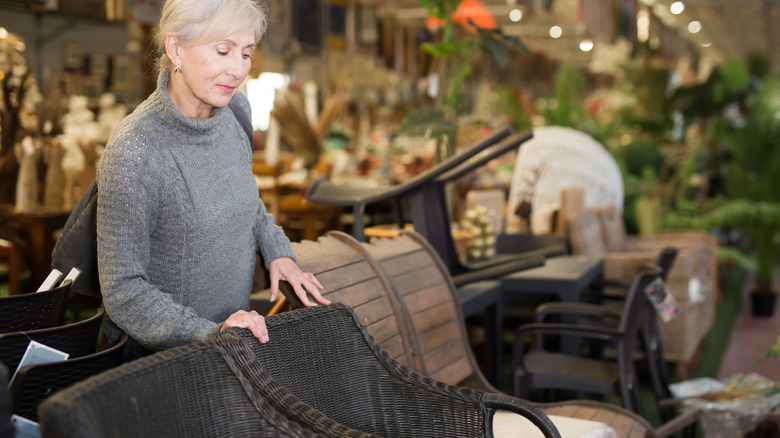 A woman shopping for patio furniture